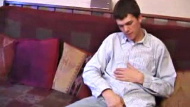 After hanging out with friends for the afternoon, Matthew finds himself on the couch with a raging boner and no one to help. So, he throws in a porn, sticks a hand down his pants and starts playing with himself.