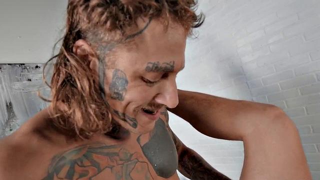 Dominant jock with tattoos barebacks businessman