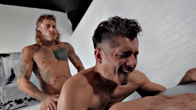 Dominant jock with tattoos barebacks businessman