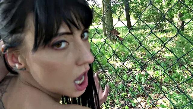 Watch this tattooed amateur brunette get her tight ass drilled against a fence in a park fantasy