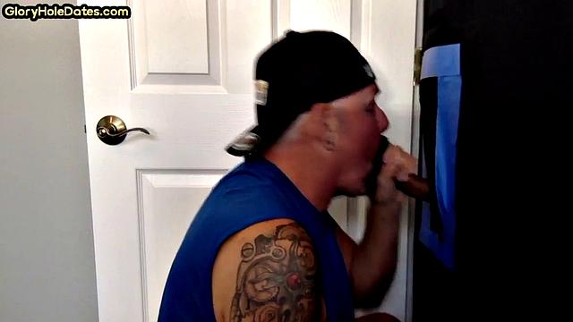 Gloryhole inked mature gay sucks cock of his BF at home