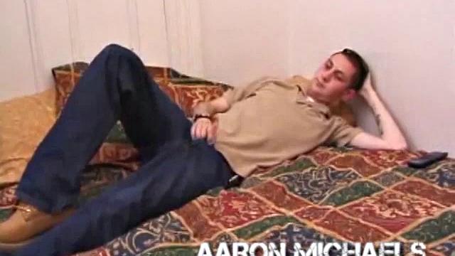 Aaron Michaels Chilling in Bedroom with Porn Video, Stroking Hard Cock, Fingers Butthole, Shoots Loads of Cum