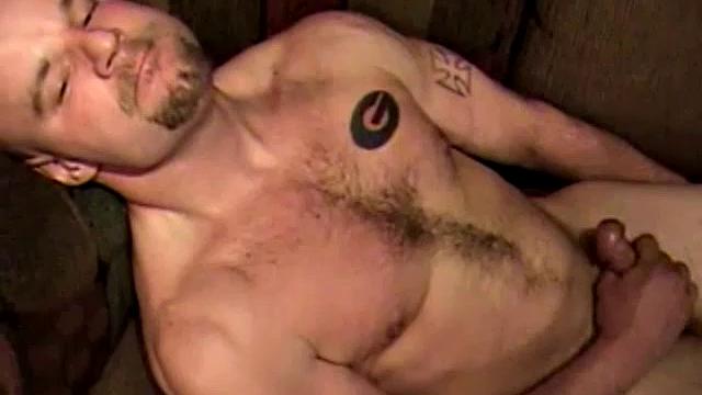 Shane is a big, cigar-smoking, hairy man, with a rough outdoors look. He works as a garbage man and is about to enter the Army. Enjoy as this muscular 28-year-old gets naked and strokes his hard cock.