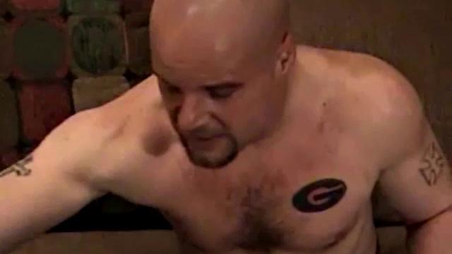 Shane is a big, cigar-smoking, hairy man, with a rough outdoors look. He works as a garbage man and is about to enter the Army. Enjoy as this muscular 28-year-old gets naked and strokes his hard cock.