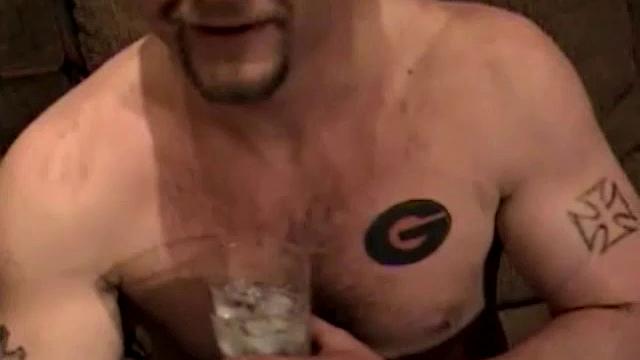 Shane is a big, cigar-smoking, hairy man, with a rough outdoors look. He works as a garbage man and is about to enter the Army. Enjoy as this muscular 28-year-old gets naked and strokes his hard cock.