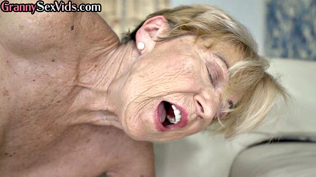 Busty granny cockriding on stud