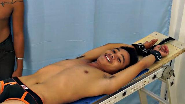 Introducing cute and ticklish Asian twink Jojo. This is his first shoot with Laughing Asians. Our long haired Asian boy Hunter is the sadistic tickler who has strapped Jojo on the tickle rack and puts him through his first tickle experience.