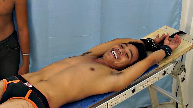 Introducing cute and ticklish Asian twink Jojo. This is his first shoot with Laughing Asians. Our long haired Asian boy Hunter is the sadistic tickler who has strapped Jojo on the tickle rack and puts him through his first tickle experience.