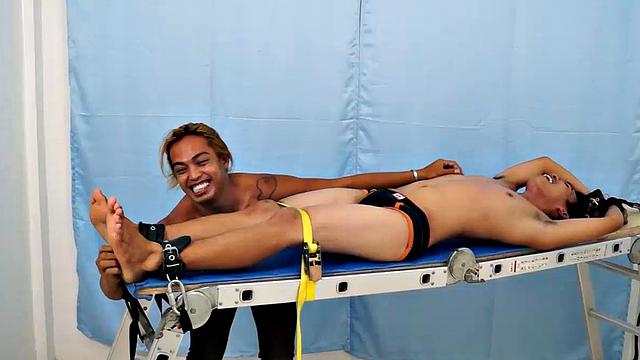 Introducing cute and ticklish Asian twink Jojo. This is his first shoot with Laughing Asians. Our long haired Asian boy Hunter is the sadistic tickler who has strapped Jojo on the tickle rack and puts him through his first tickle experience.