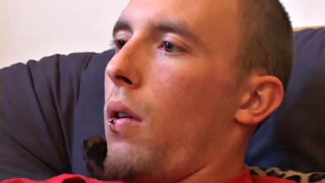 Lean and mean Corbin Ross peels of his jeans and plops down to start working his cock. He lifts his red shirt to reveal his flat abs and keep from soiling it with the cum he's working on.