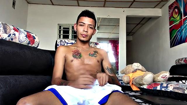 Inked Latino gets nude and masturbates on couch