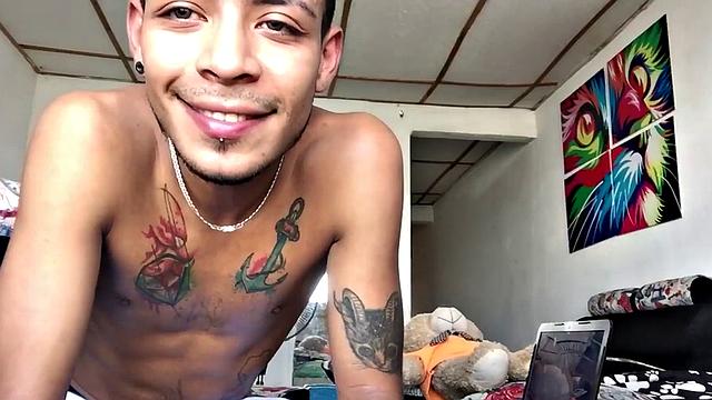 Inked Latino gets nude and masturbates on couch