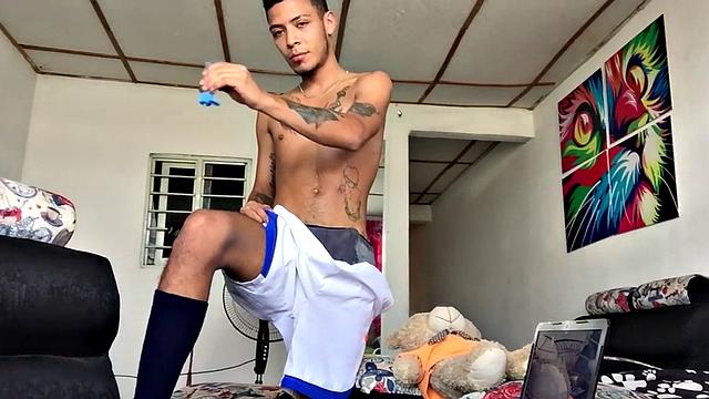 Inked Latino gets nude and masturbates on couch