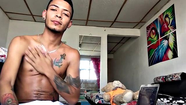 Inked Latino gets nude and masturbates on couch
