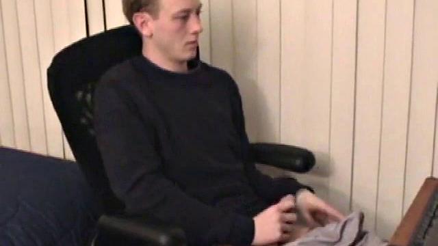 Young Corbin is back and this time, he's at his computer working a growing bulge inside his sweats. When he tugs down the sweats, we see his boner.