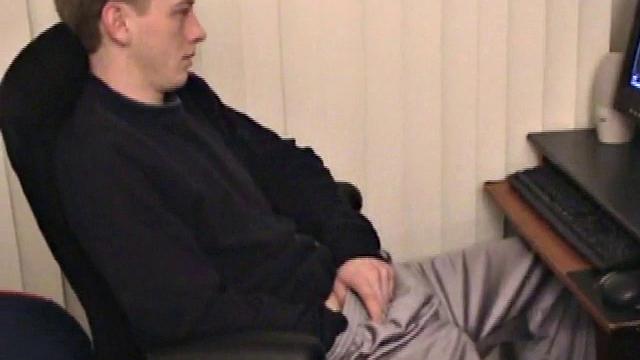 Young Corbin is back and this time, he's at his computer working a growing bulge inside his sweats. When he tugs down the sweats, we see his boner.