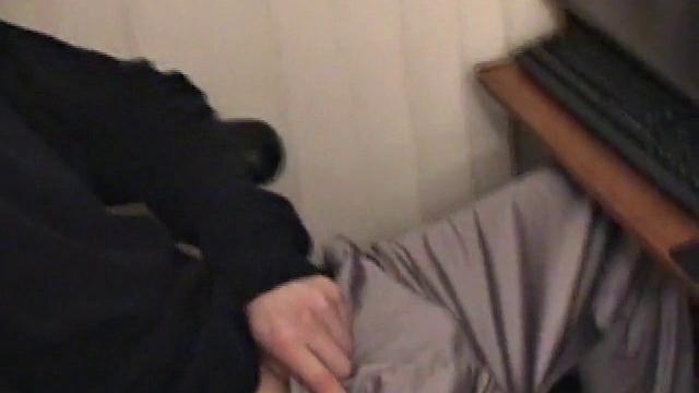 Young Corbin is back and this time, he's at his computer working a growing bulge inside his sweats. When he tugs down the sweats, we see his boner.