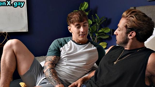 Inked jock wanks while fucked by his BF