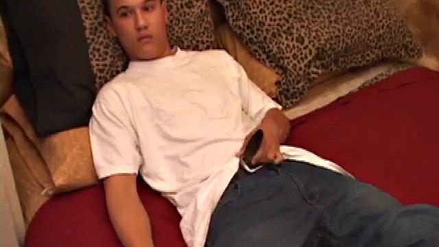 New to gay porn, 18 year old Arik is sweet, quiet and eager to please. With a video playing on the TV, Arik works his growing package, before stripping naked. His cock is already hard and he gets busy stroking it.