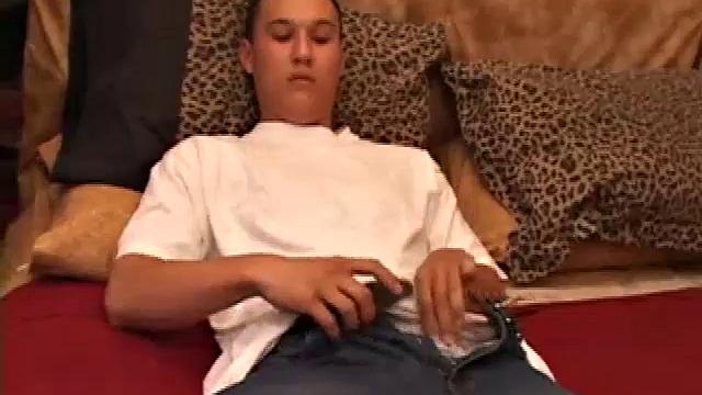 New to gay porn, 18 year old Arik is sweet, quiet and eager to please. With a video playing on the TV, Arik works his growing package, before stripping naked. His cock is already hard and he gets busy stroking it.