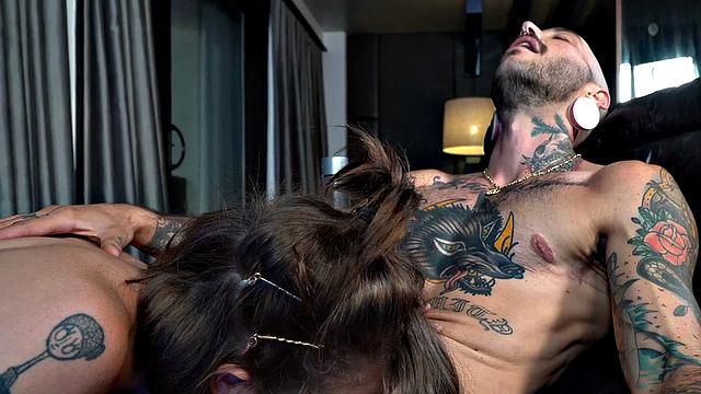 Tattooed TS man with pussy licked by busty TS in heels