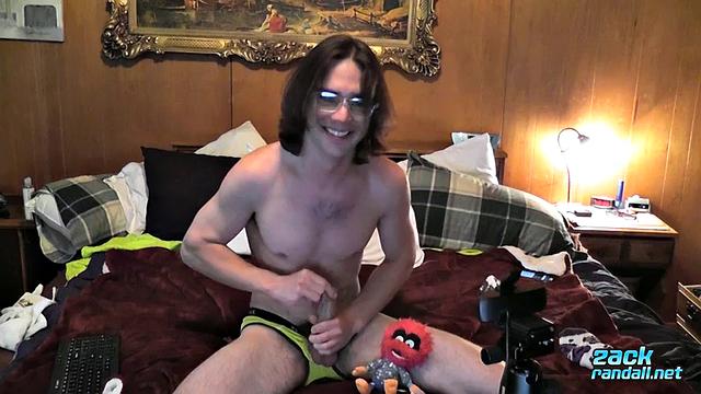Zack Randall strokes his thick cock and shoots a heavy load for the camera