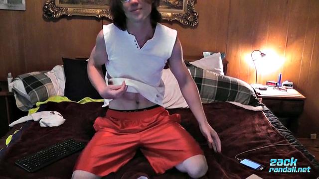 Zack Randall strokes his thick cock and shoots a heavy load for the camera
