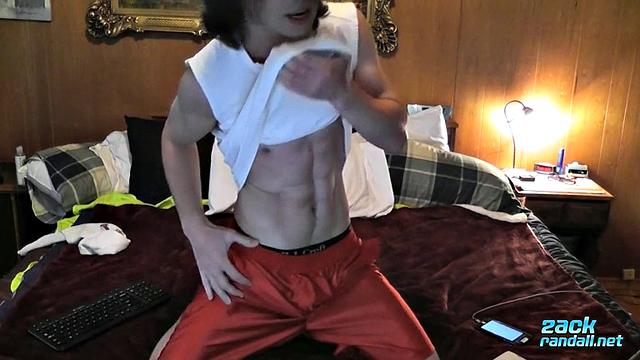 Zack Randall strokes his thick cock and shoots a heavy load for the camera
