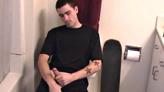 Dan strokes his hard cock and can't hold back