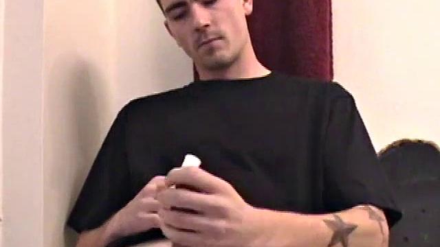 Dan strokes his hard cock and can't hold back