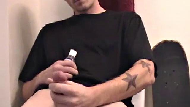 Dan strokes his hard cock and can't hold back
