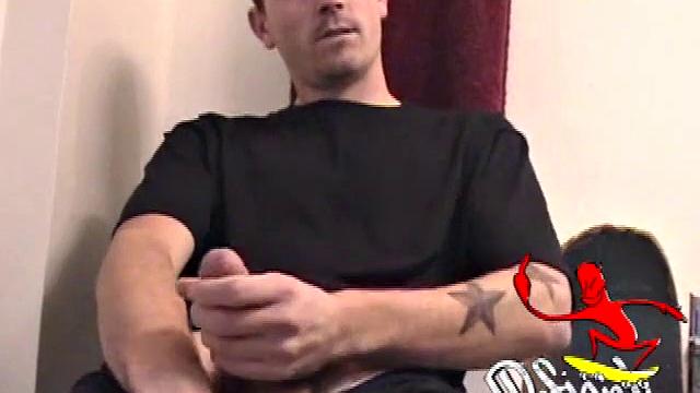 Dan strokes his hard cock and can't hold back