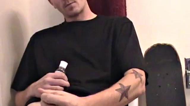 Dan strokes his hard cock and can't hold back