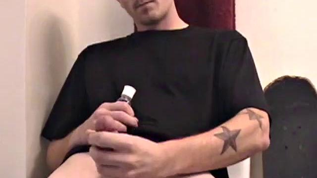 Dan strokes his hard cock and can't hold back