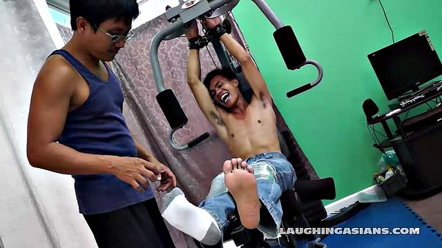 If you love male foot tickling, you're going to love this one! Cute Asian Boy Argie Comes by for a Gym Workout with His Trainer. The Gym Trainer Secures Argie for Vigorous Leg Workout.