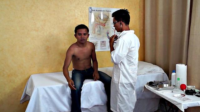 Slim Asian bottom fingered by medic before bareback sex