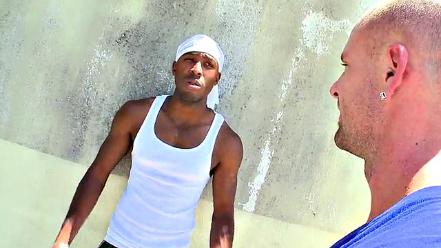 Watch this hot interracial pornstar take it in the ass from a white guy's topless tank top