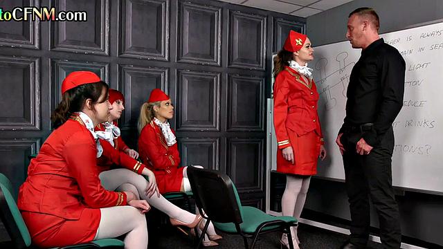 CFNM stewardess in uniform sucking and wanking pilot together