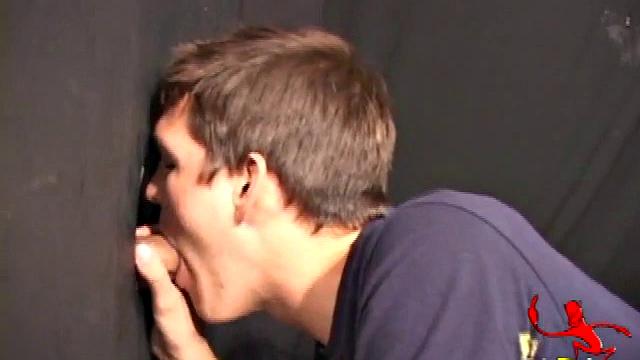 Ник сосет член через дырку в стене и дрочит рукой