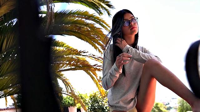 Lil Mia showing her natural tits and shaved pussy outdoor. She rubs her natural tits and pussy, fingering until orgasm