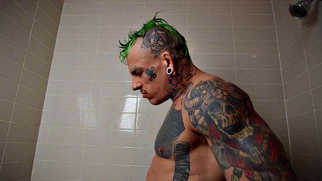 Inked hunk fucking twink in shower after blowjob