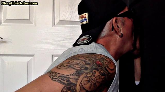 Tattooed DILF sucks gloryhole dick till cum in mouth