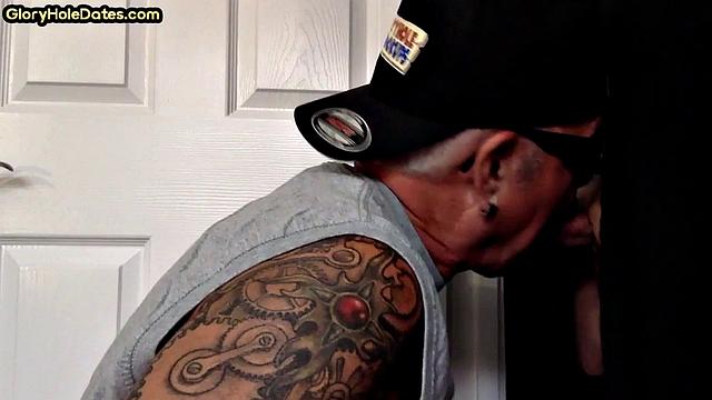Tattooed DILF sucks gloryhole dick till cum in mouth