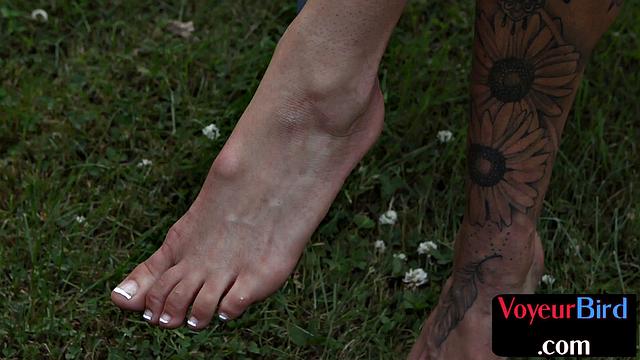 Outdoor amateur voyeur enjoys as she sees guy jerking