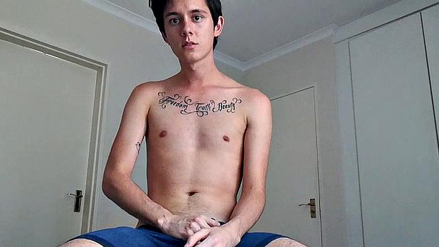 Ant is a slim and smooth twink, with that boy next door look, until the shirt peels off revealing an inked chest. He pushes his shorts down just enough to give us a peek at his fine looking little butt and big uncut cock.
