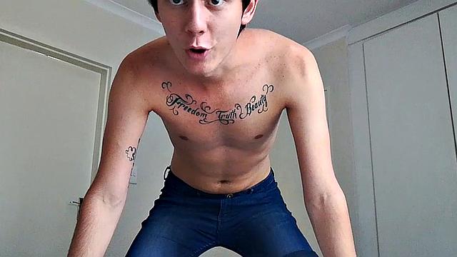 Ant is a slim and smooth twink, with that boy next door look, until the shirt peels off revealing an inked chest. He pushes his shorts down just enough to give us a peek at his fine looking little butt and big uncut cock.