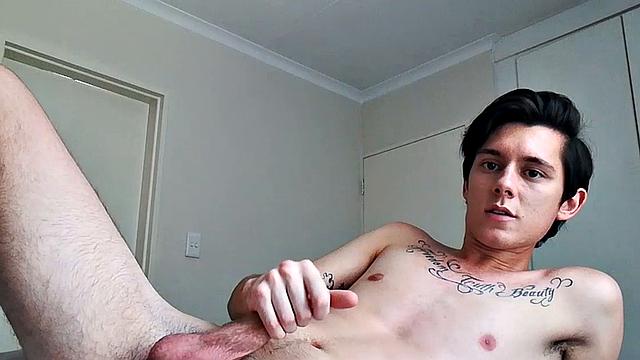 Ant is a slim and smooth twink, with that boy next door look, until the shirt peels off revealing an inked chest. He pushes his shorts down just enough to give us a peek at his fine looking little butt and big uncut cock.