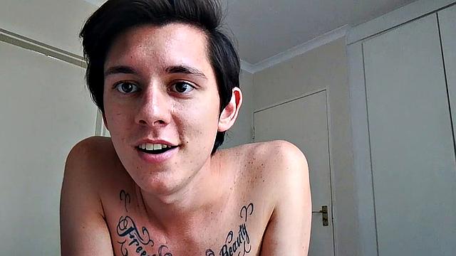 Ant is a slim and smooth twink, with that boy next door look, until the shirt peels off revealing an inked chest. He pushes his shorts down just enough to give us a peek at his fine looking little butt and big uncut cock.