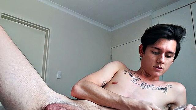 Ant is a slim and smooth twink, with that boy next door look, until the shirt peels off revealing an inked chest. He pushes his shorts down just enough to give us a peek at his fine looking little butt and big uncut cock.