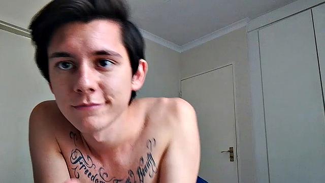 Ant is a slim and smooth twink, with that boy next door look, until the shirt peels off revealing an inked chest. He pushes his shorts down just enough to give us a peek at his fine looking little butt and big uncut cock.